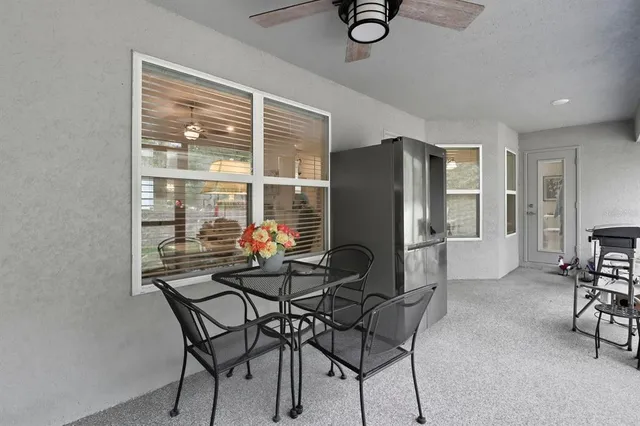 a dining room with furniture and window