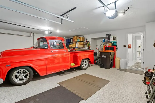a view of a garage with a car and car parked