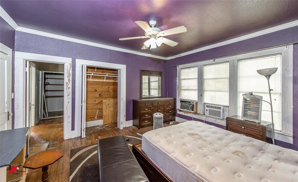 179 Daniel Thomas Road Springhill, LA 71075 - Photo 17 of 37 Bedroom featuring cooling unit, a ceiling fan, ornamental molding, and wood finished floors