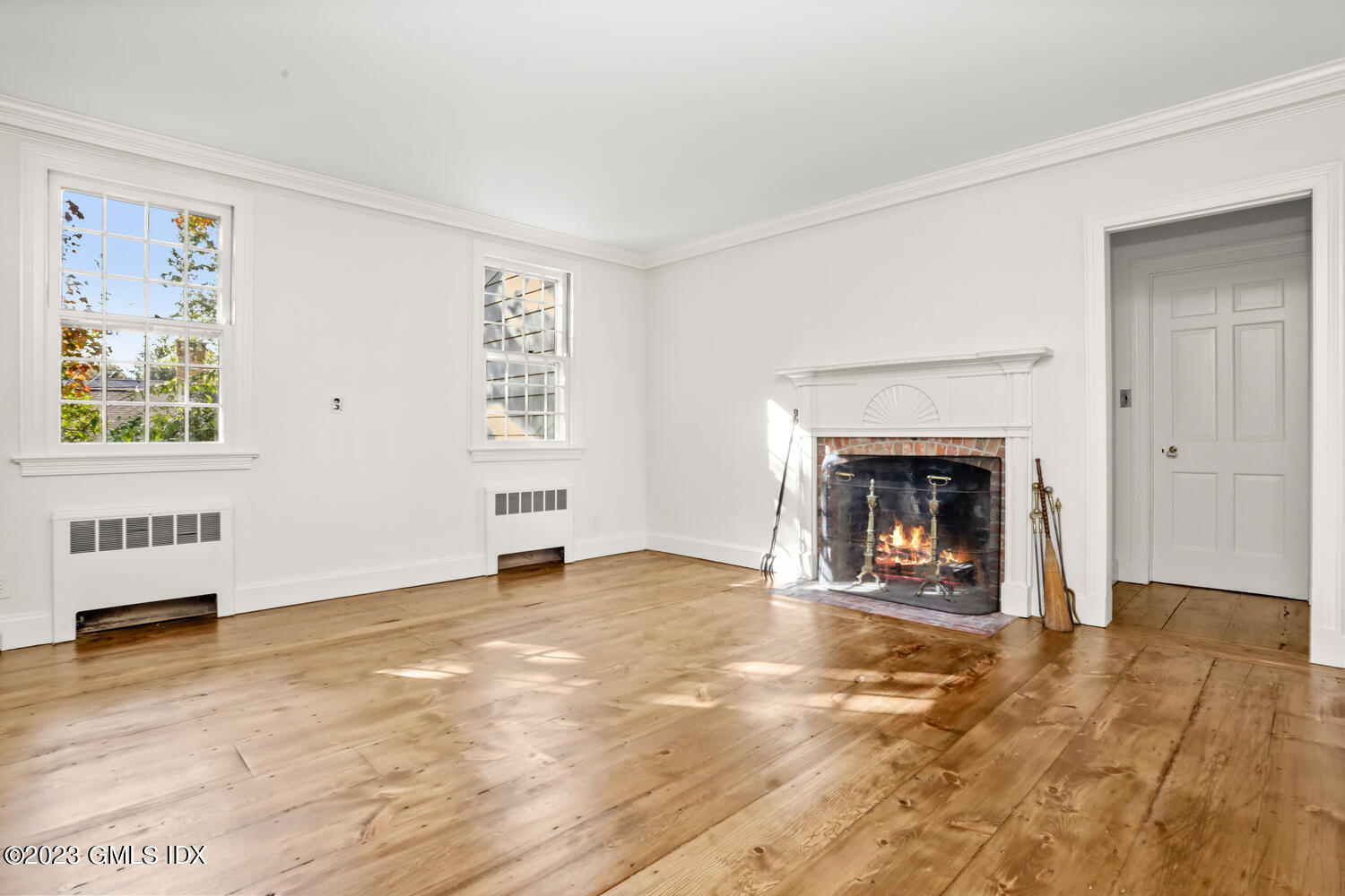 35 Ridgeview Avenue Greenwich, CT 06830 - Photo 3 of 16 a view of an empty room with window and a fireplace