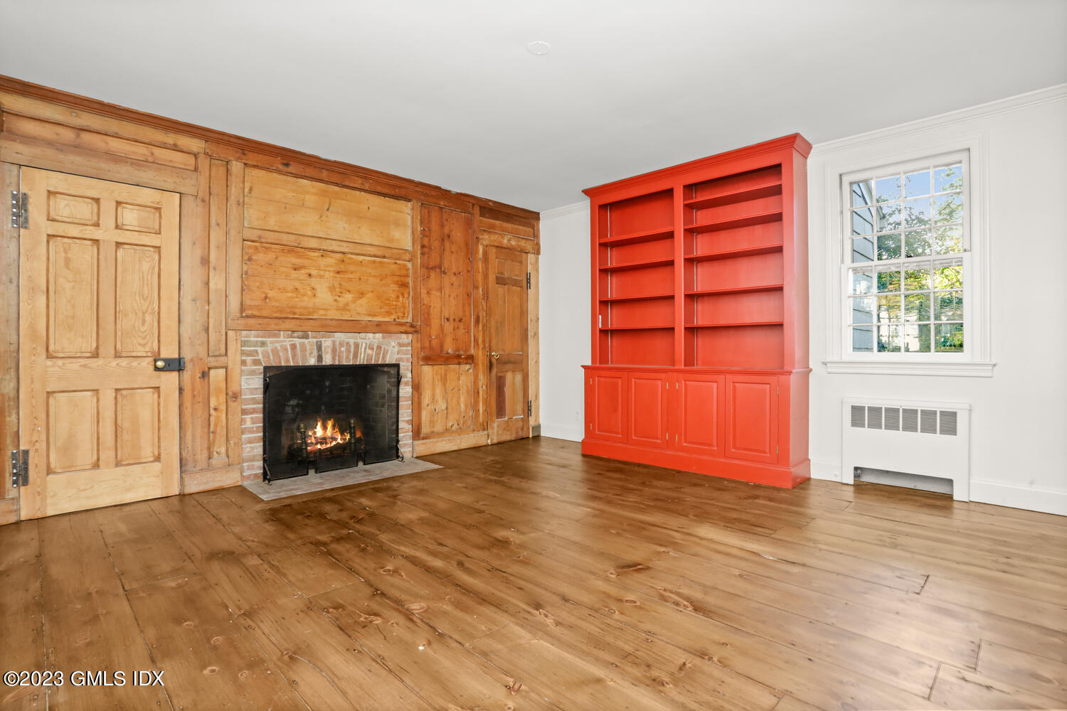 35 Ridgeview Avenue Greenwich, CT 06830 - Photo 5 of 16 a view of an empty room with a fireplace and a window