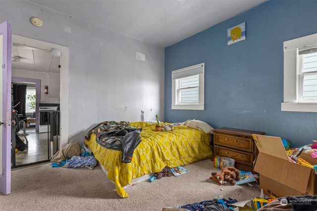 a room with gym equipment and a large window