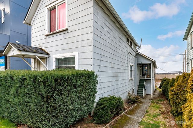 a view of swimming pool with outdoor seating and plants