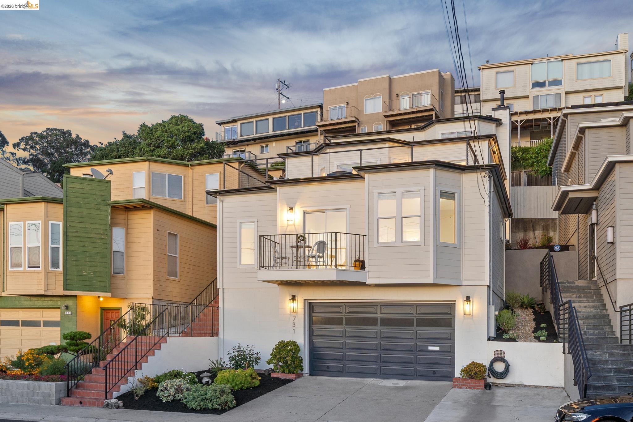 731 Gateview Avenue Albany, CA 94706 - Photo 1 of 1 View of front of house with a balcony, an attached garage, concrete driveway, and a residential view
