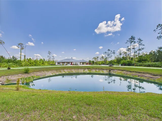a view of a golf course with a lake