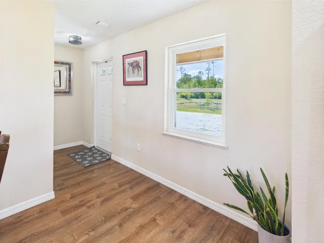 a living room with furniture fireplace and flat screen tv
