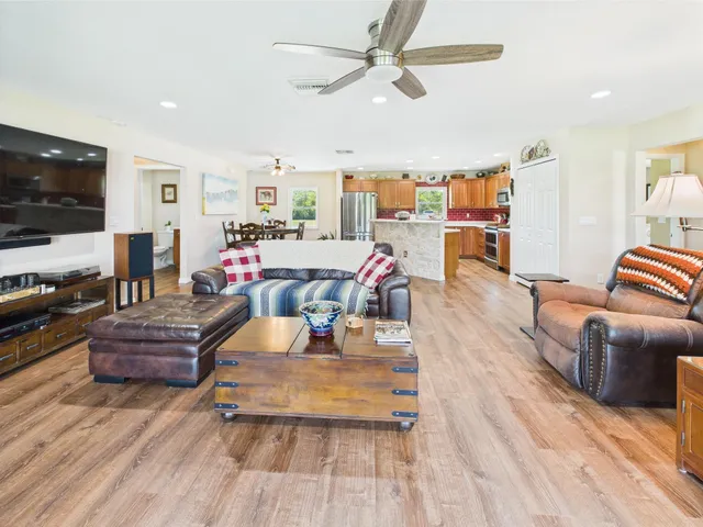 a kitchen with stainless steel appliances a sink and a refrigerator