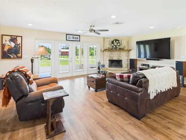 a view of a hallway with wooden floor and closet