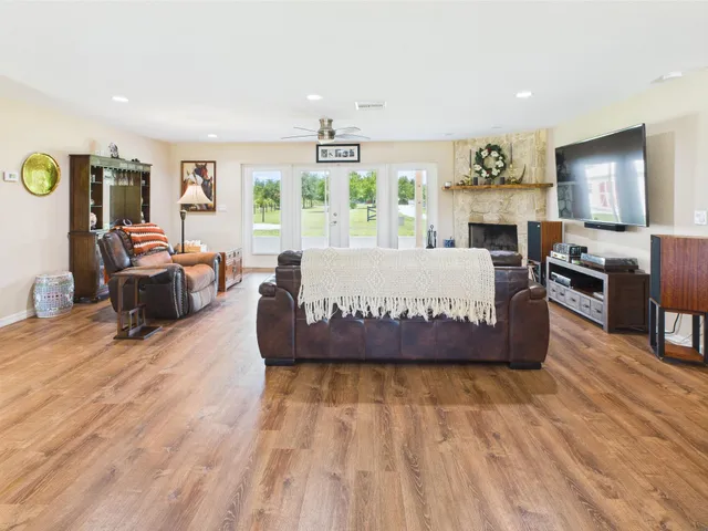 a bathroom with a bathtub sink and a mirror