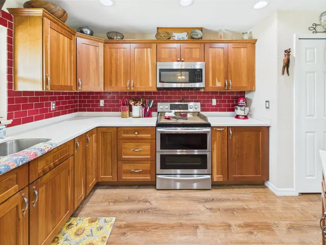 a spacious bathroom with a bathtub sink and mirror