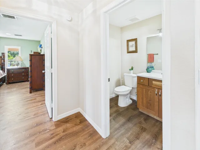 a spacious bathroom with a double vanity sink and a mirror