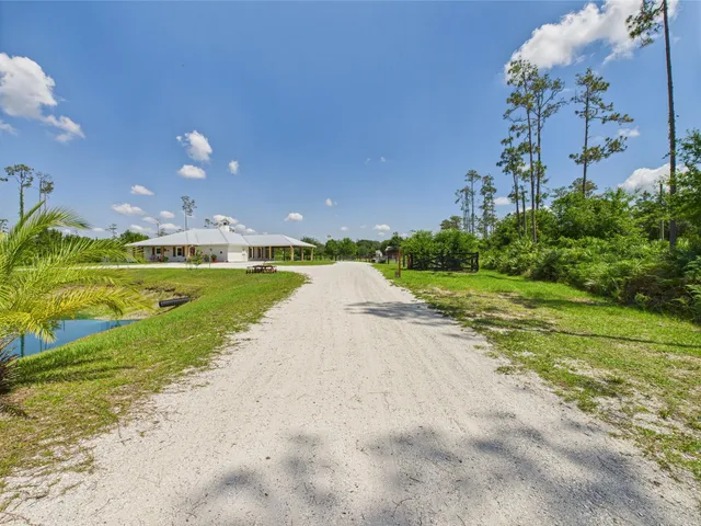a view of a house with a big yard