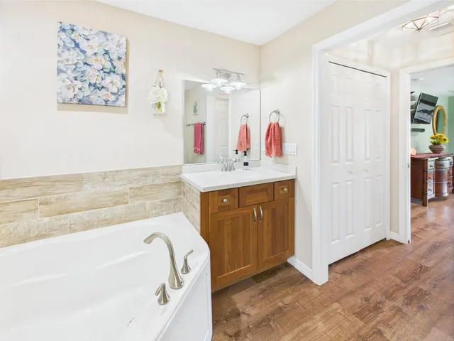 a view of a house with a yard and garage