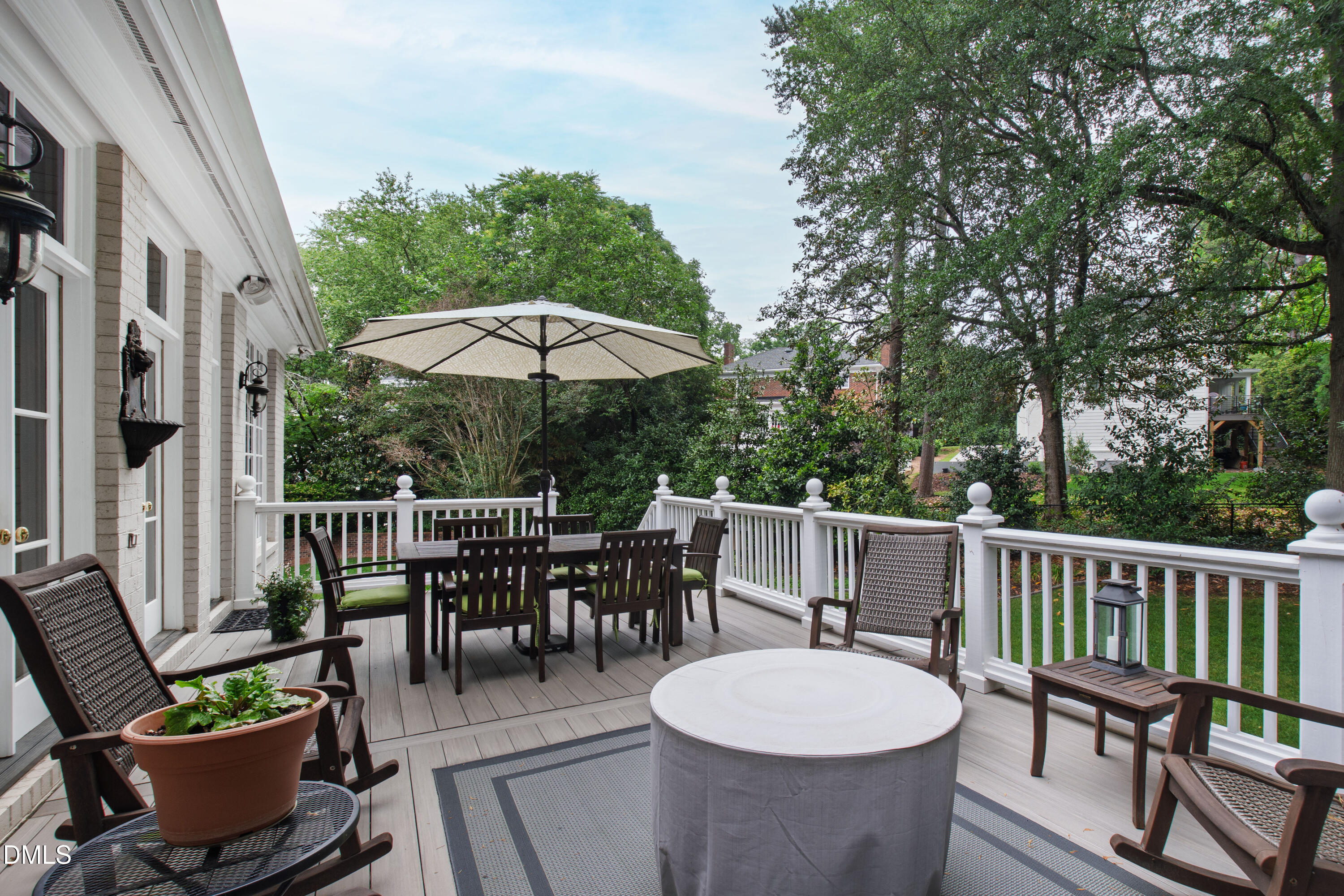 2536 Wake Drive Raleigh, NC 27608 - Photo 71 of 74 a view of a patio with a dining table and chairs