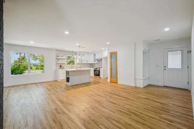 a view of kitchen with wooden floor