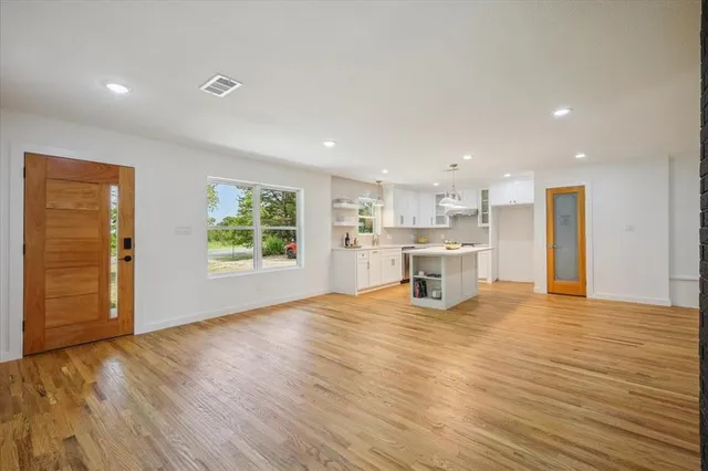 a view of a kitchen with furniture and a window