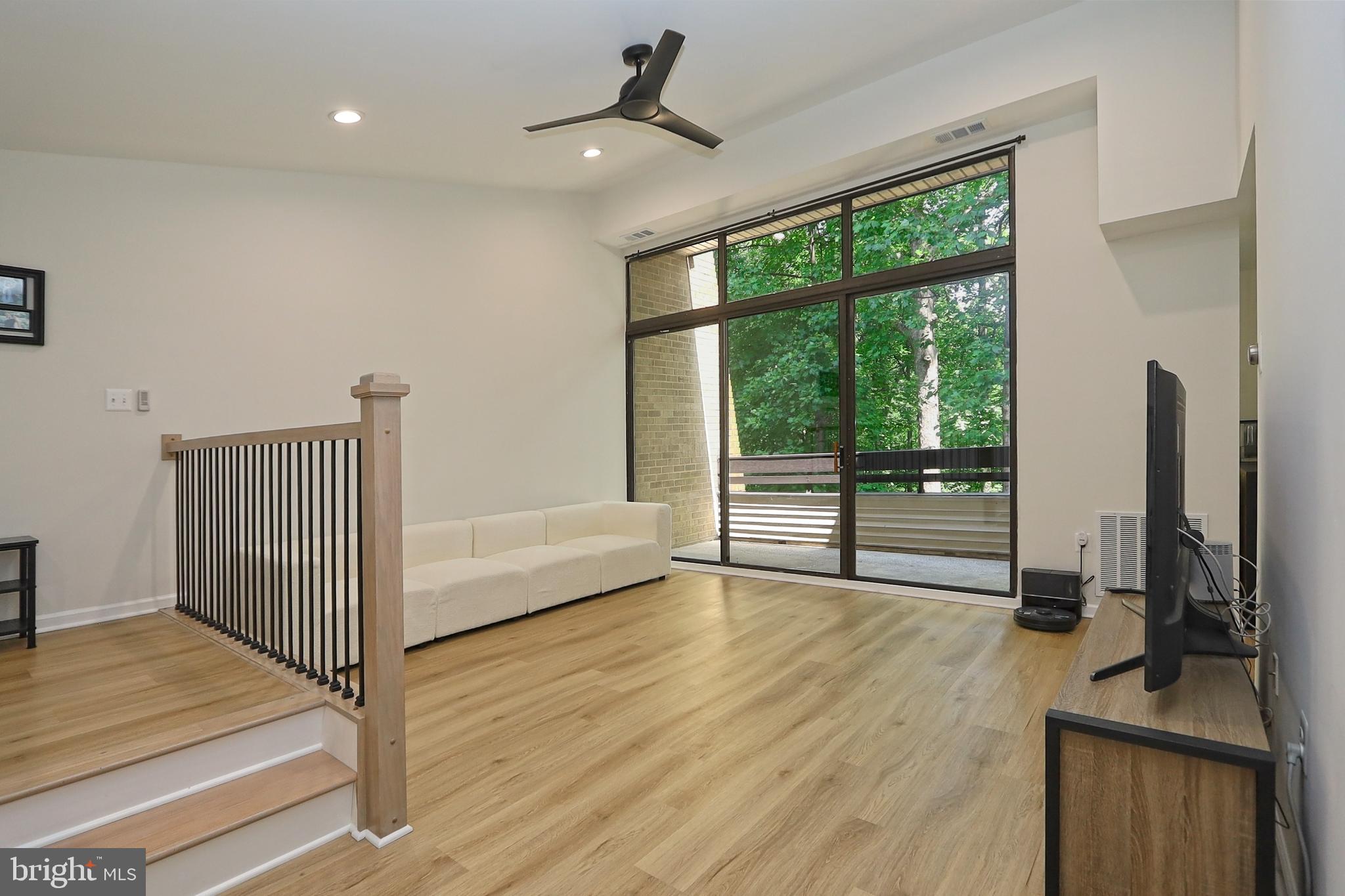 2104 Green Watch Way, Unit 301 Reston, VA 20191 - Photo 3 of 33 Spacious living room w/high ceiling + custom fan
