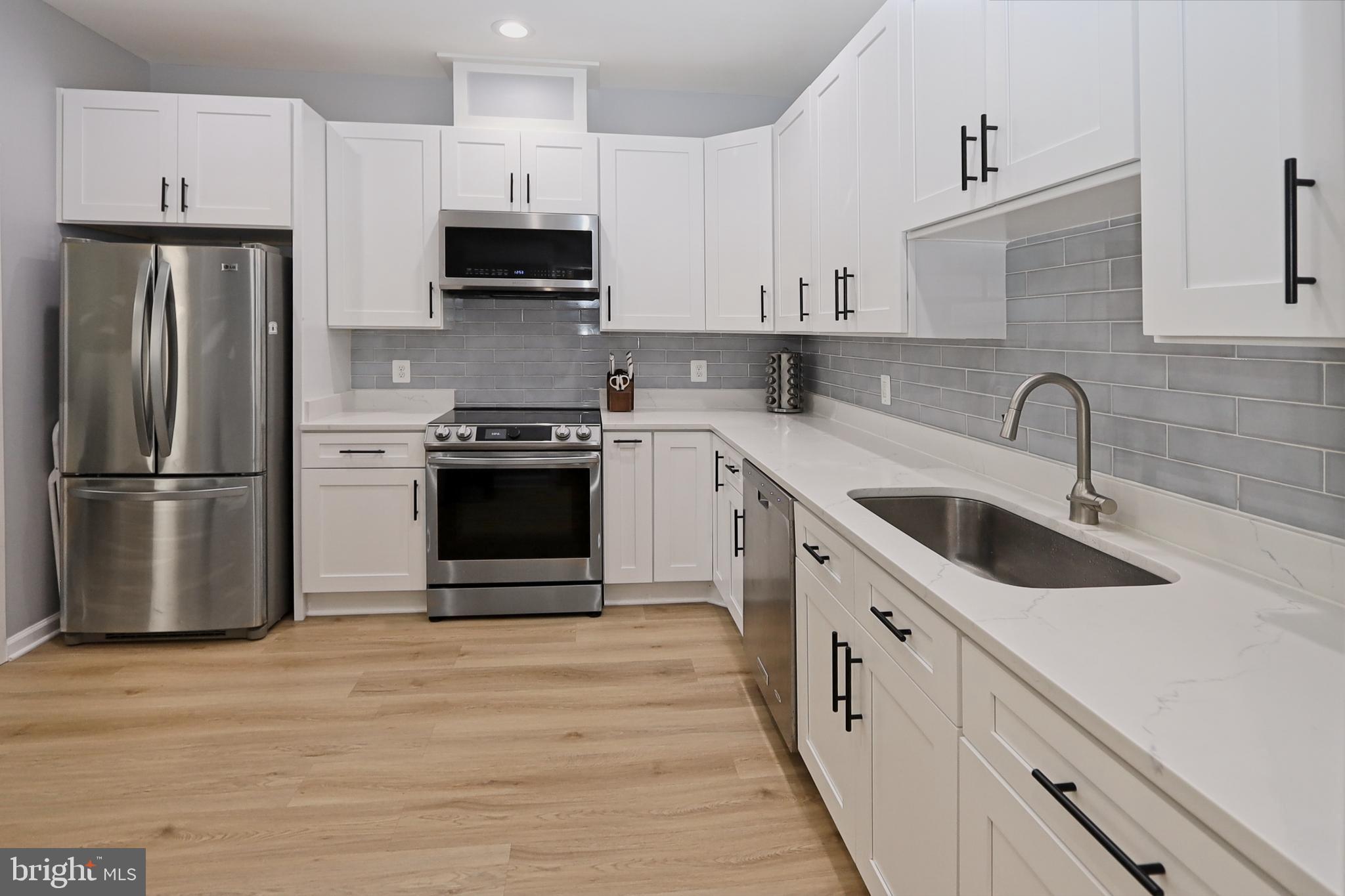 2104 Green Watch Way, Unit 301 Reston, VA 20191 - Photo 8 of 33 Stainless appliances and LVP flooring