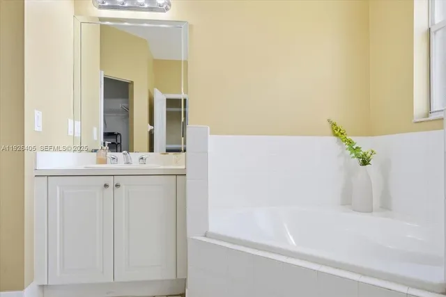 a bathroom with a bathtub and a sink