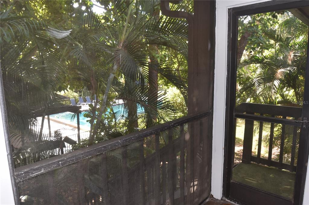 1709 Pelican Cove Road, Unit GL446 Sarasota, FL 34231 - Photo 6 of 25 a view of a house with a tree