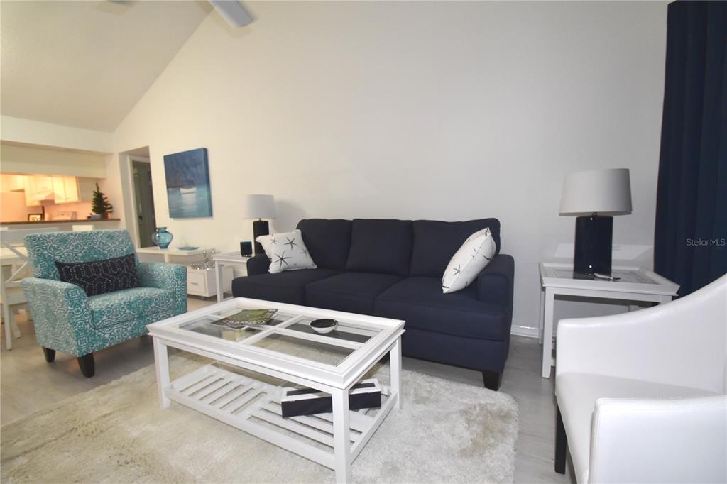 1709 Pelican Cove Road, Unit GL446 Sarasota, FL 34231 - Photo 8 of 25 a living room with furniture and a couch