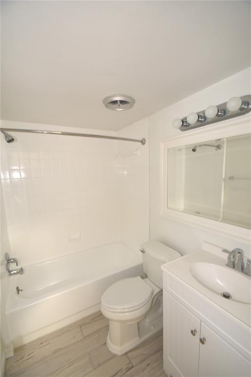 1709 Pelican Cove Road, Unit GL446 Sarasota, FL 34231 - Photo 10 of 25 a bathroom with a sink a toilet and shower