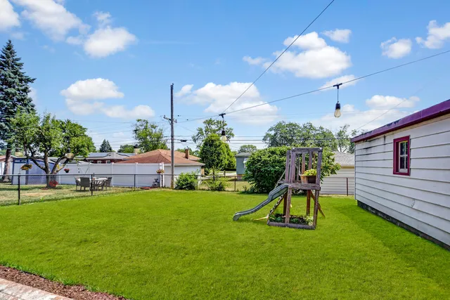 a view of a house with a backyard porch and sitting area