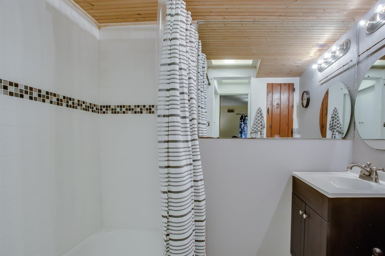 2515 25th Street Lubbock, TX 79410 - Photo 12 of 16 a bathroom with a sink and a mirror