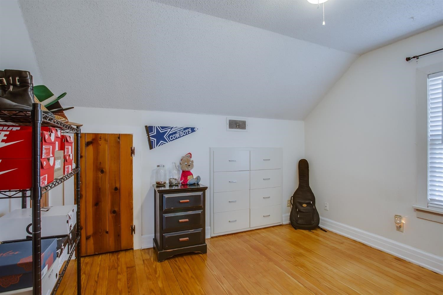 2515 25th Street Lubbock, TX 79410 - Photo 13 of 16 a view of a bedroom with closet and cabinet