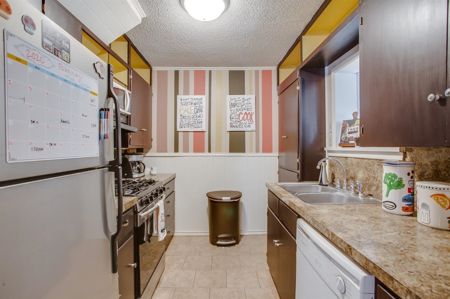 2515 25th Street Lubbock, TX 79410 - Photo 4 of 16 a kitchen with a refrigerator and a sink
