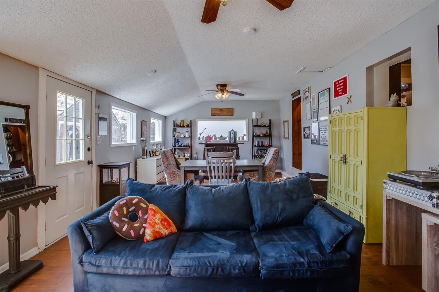 2515 25th Street Lubbock, TX 79410 - Photo 8 of 16 a living room with furniture and a flat screen tv