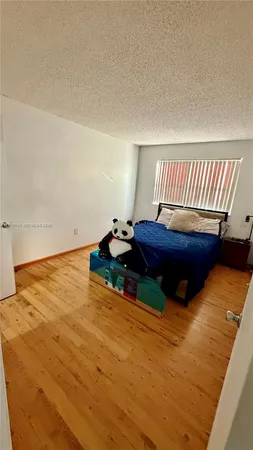 a room with a bed and a night stand