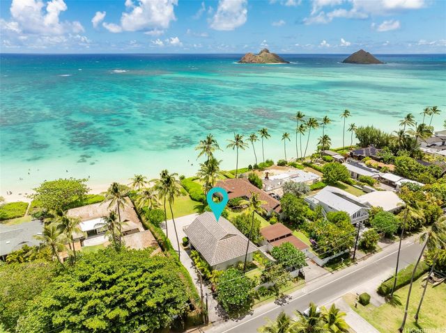 an aerial view of a house with a yard