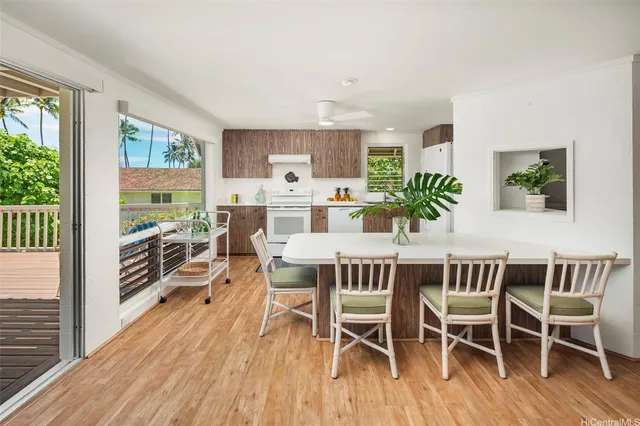 a room with pool table and windows