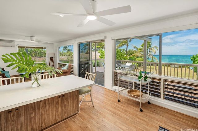 a spacious bedroom with a bed and large window