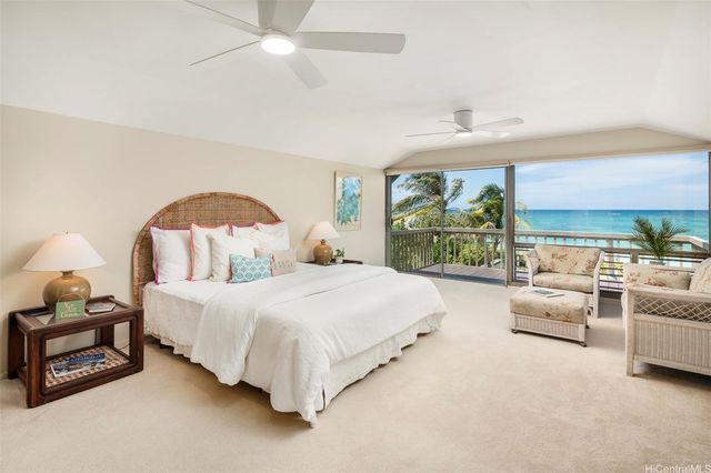 a view of a balcony with wooden floor