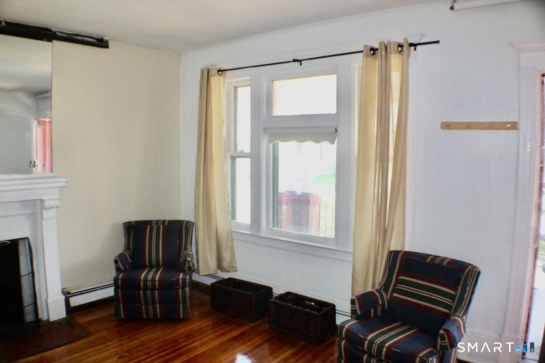 150 Whitney Street Hartford, CT 06105 - Photo 35 of 39 a living room with furniture and a window