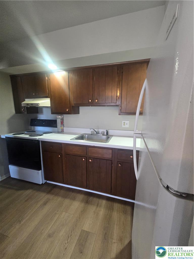 188 Jefferson Street, Unit 2 Emmaus, PA 18049 - Photo 6 of 9 a kitchen with a sink cabinets and wooden floor