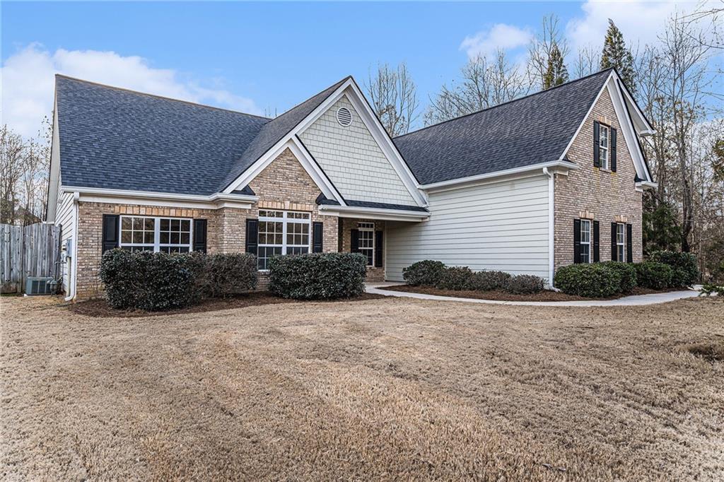 a front view of a house with a yard