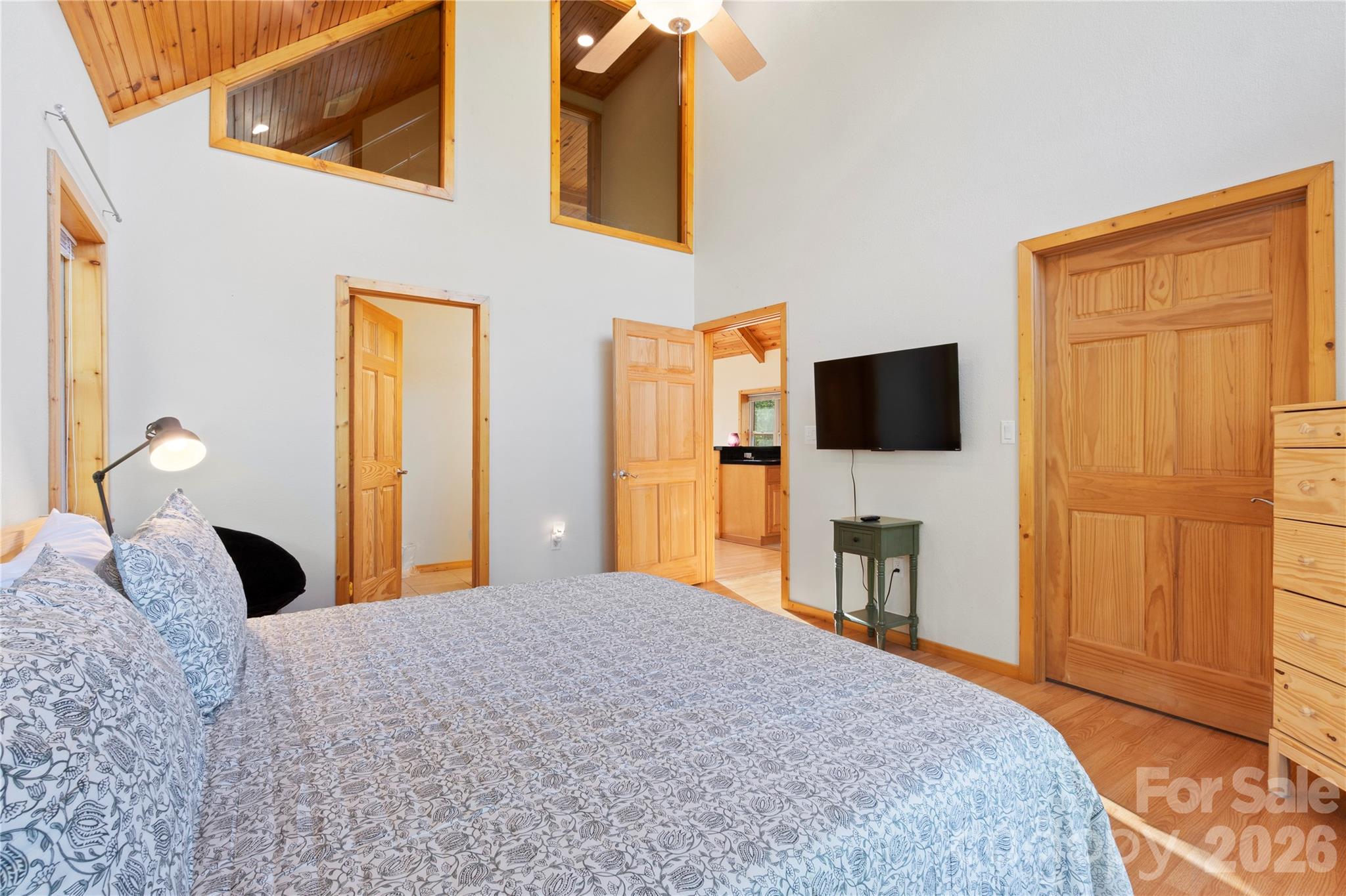 273 North Rhododendron Road Almond, NC 28702 - Photo 18 of 27 a bedroom with a bed and a flat screen tv