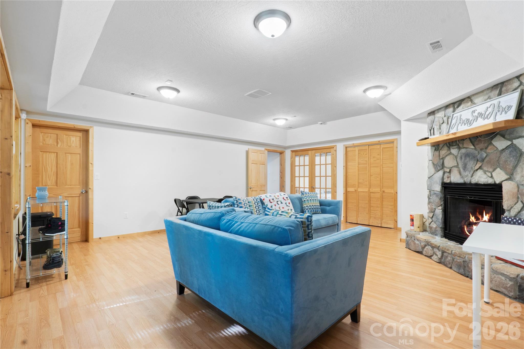 273 North Rhododendron Road Almond, NC 28702 - Photo 20 of 27 a living room with furniture and a fireplace