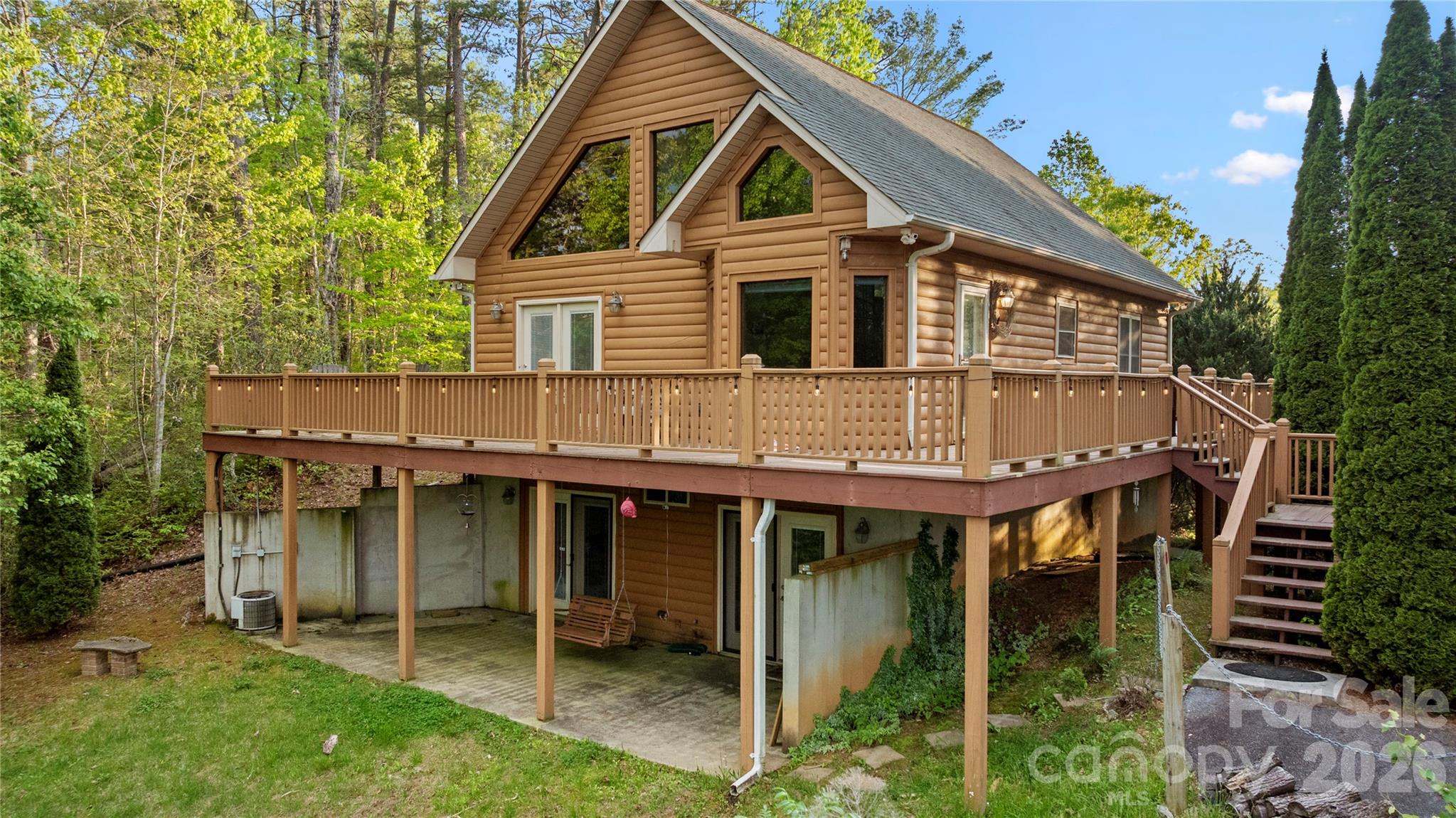 273 North Rhododendron Road Almond, NC 28702 - Photo 6 of 27 a backyard of a house with table and chairs