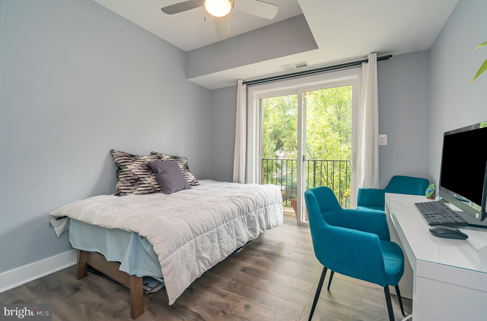 1340 Nicholson Street Northwest, Unit 5 Washington, DC 20011 - Photo 11 of 27 a bedroom with a bed and a table