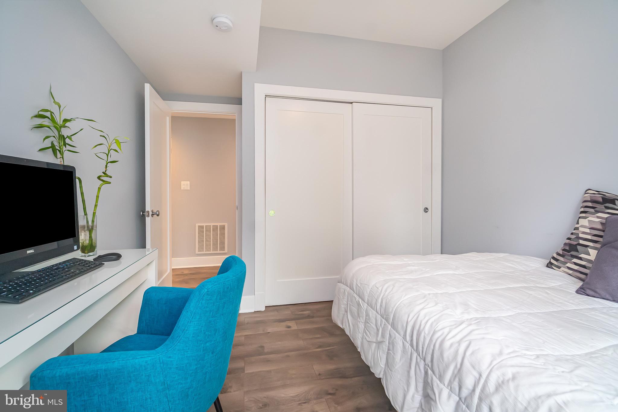 1340 Nicholson Street Northwest, Unit 5 Washington, DC 20011 - Photo 12 of 27 a bedroom with a bed and a flat screen tv