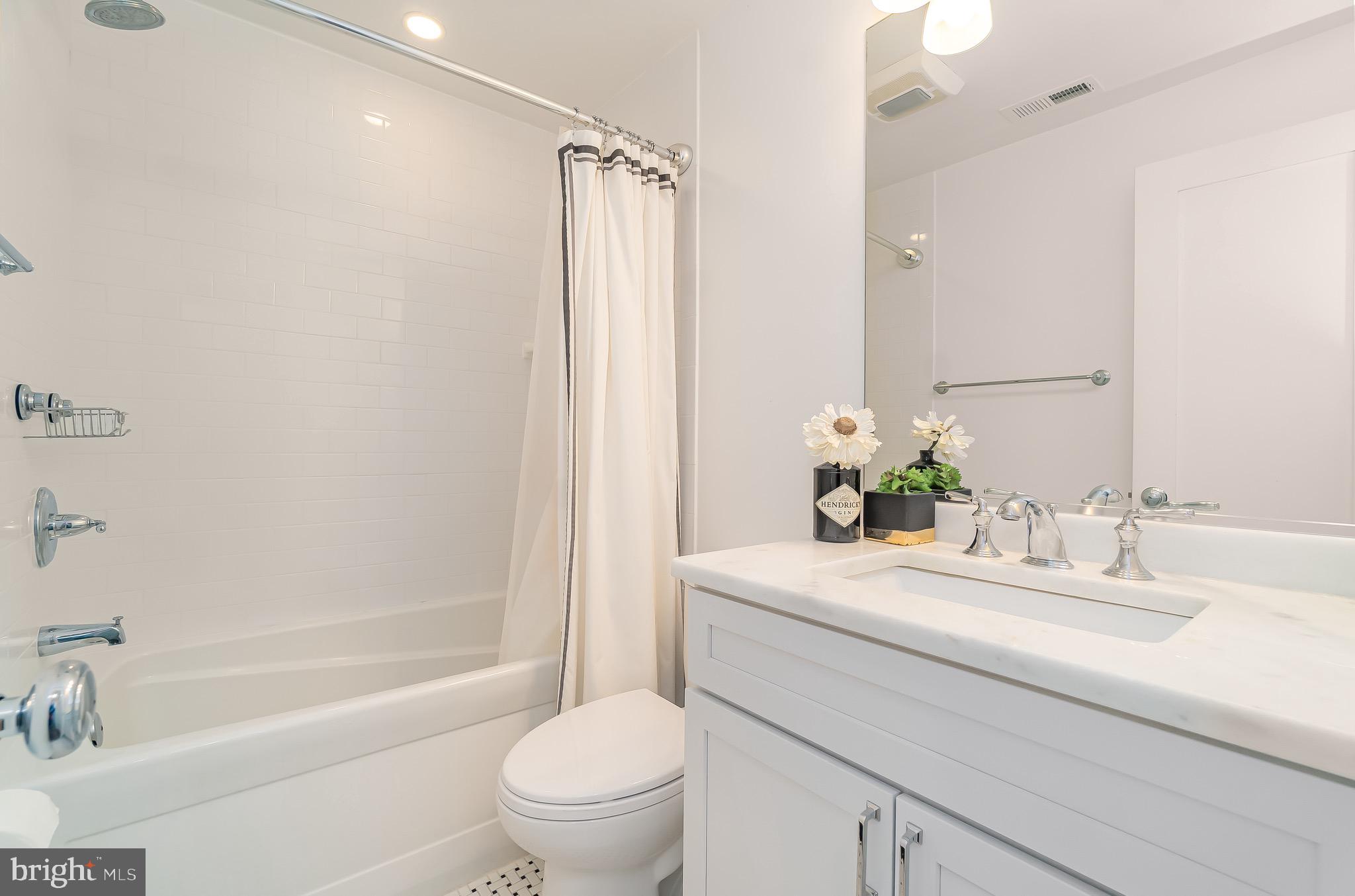 1340 Nicholson Street Northwest, Unit 5 Washington, DC 20011 - Photo 13 of 27 a bathroom with a sink toilet and shower