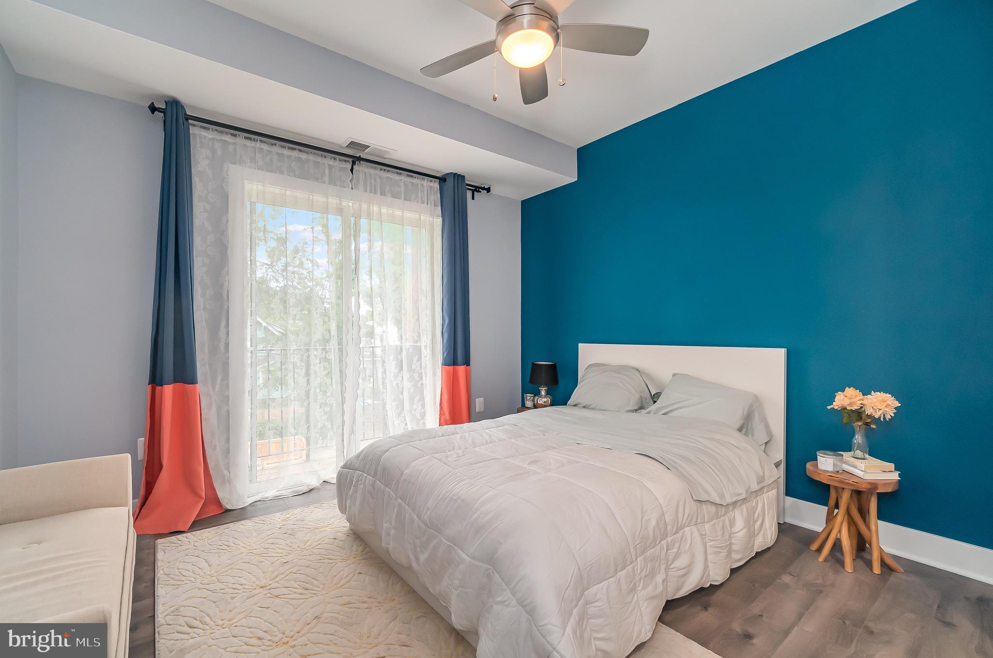 1340 Nicholson Street Northwest, Unit 5 Washington, DC 20011 - Photo 14 of 27 a bedroom with a bed and a chandelier