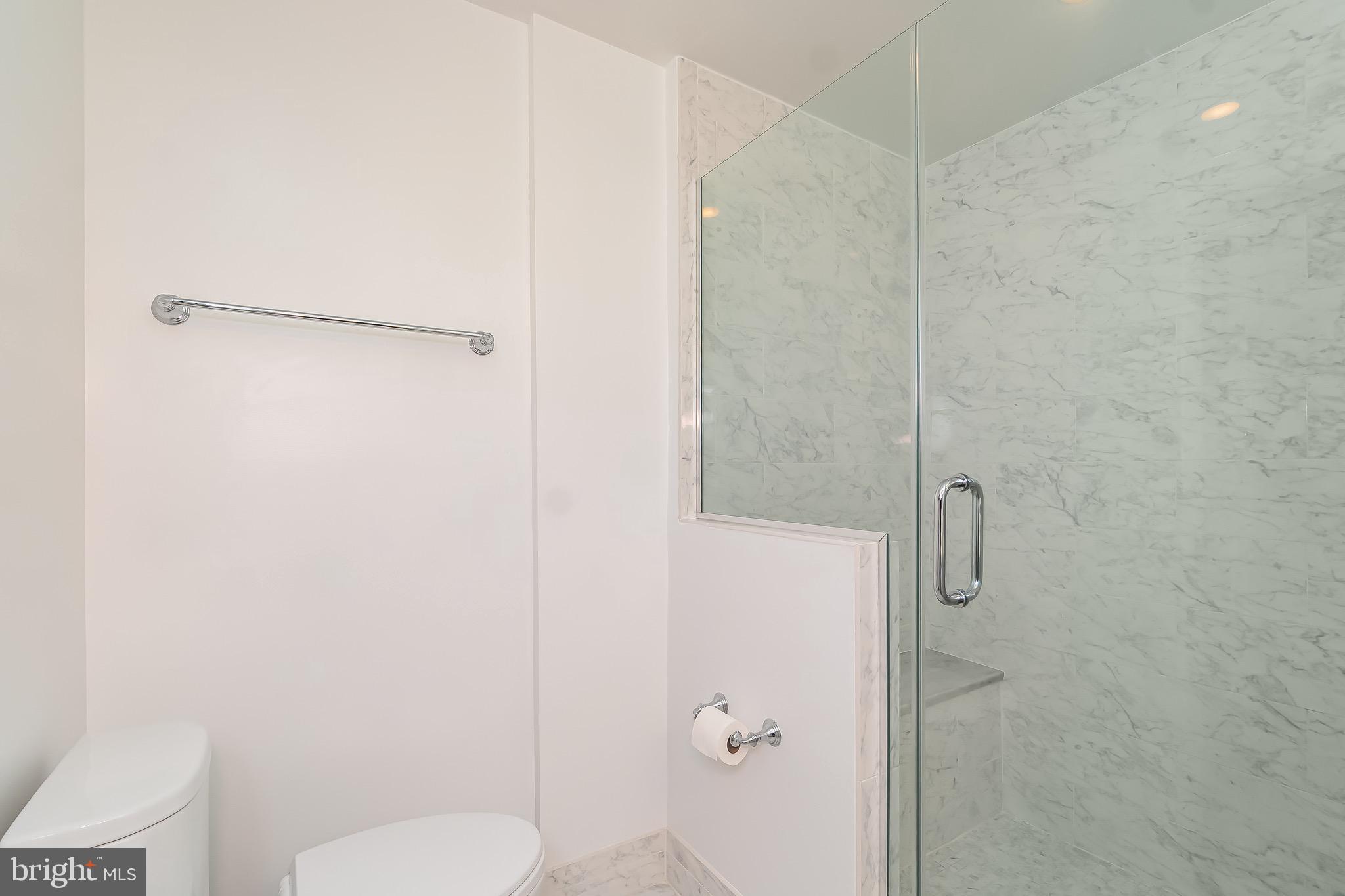 1340 Nicholson Street Northwest, Unit 5 Washington, DC 20011 - Photo 18 of 27 a bathroom with a toilet and a shower