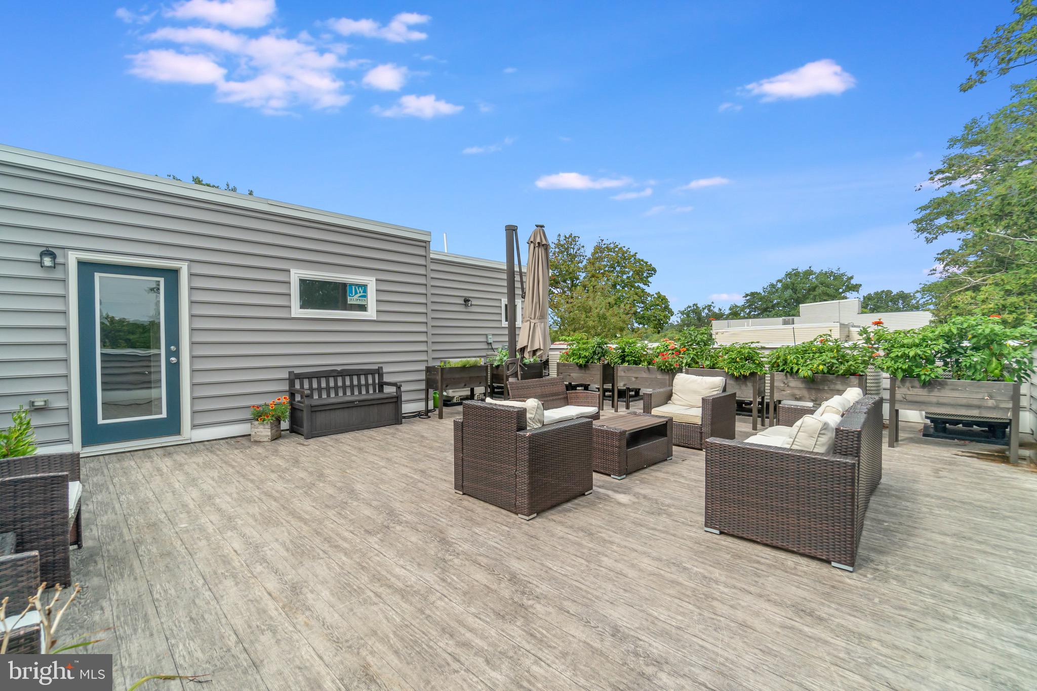 1340 Nicholson Street Northwest, Unit 5 Washington, DC 20011 - Photo 25 of 27 a view of a terrace with furniture and a garden