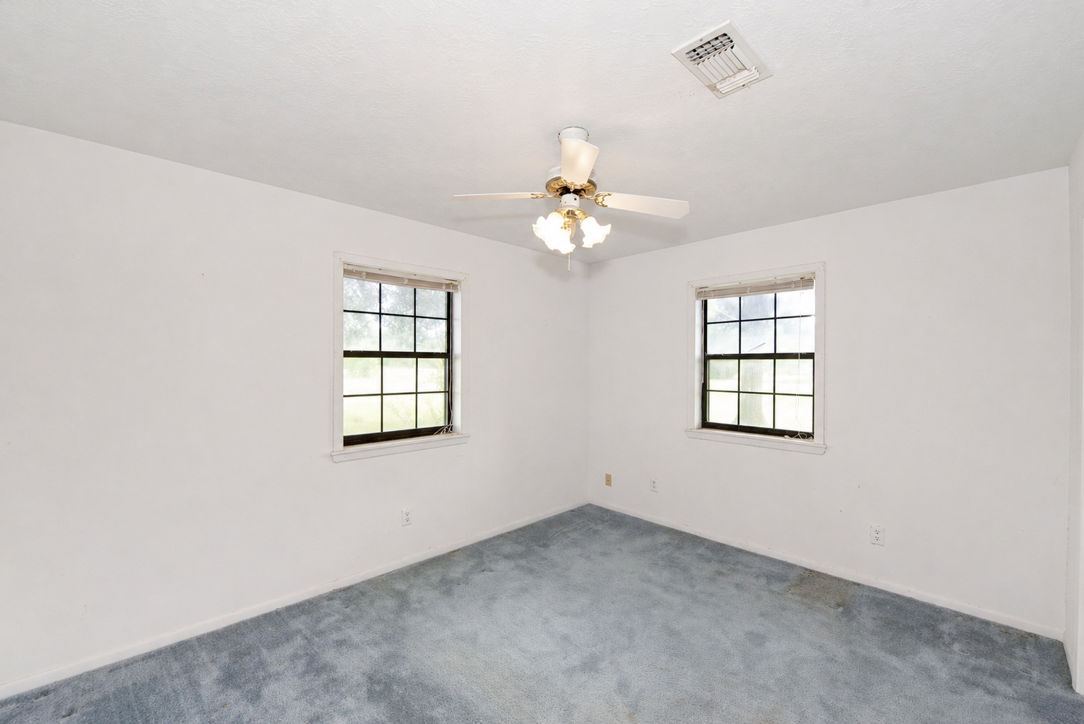 10565 Farm To Market 2155 Loop Snook, TX 77879 - Photo 10 of 10 an empty room with windows and chandelier fan