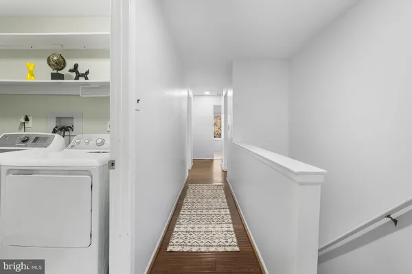 a hallway with washer and dryer